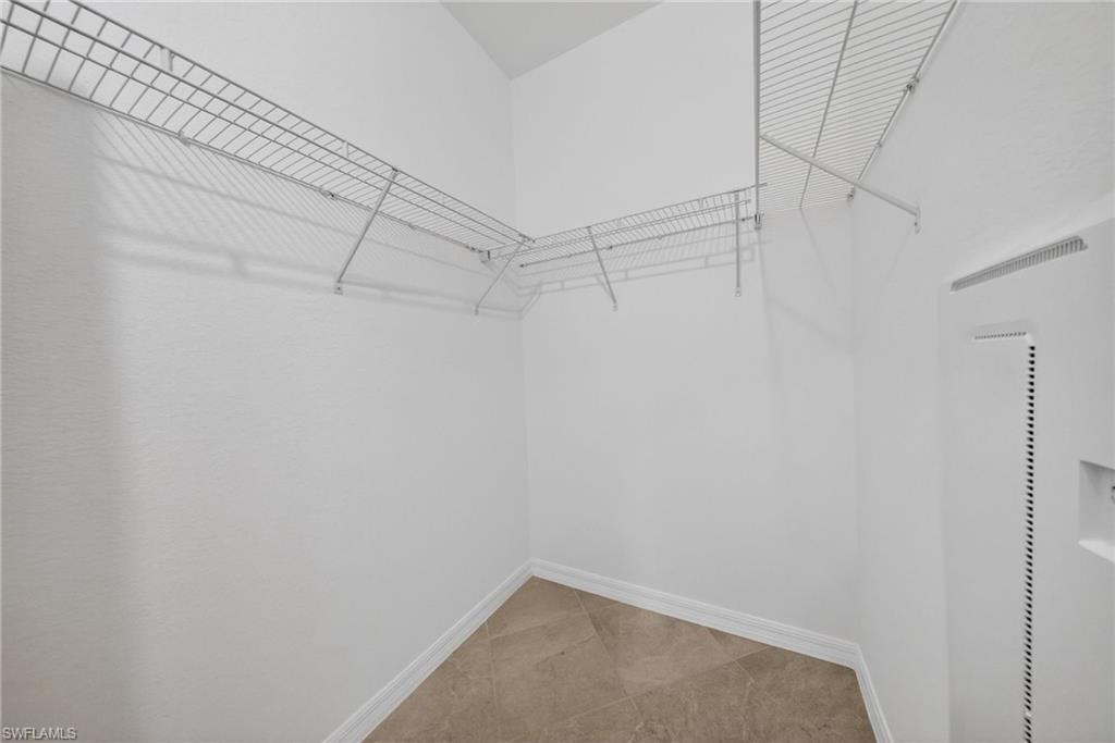 2220 Dragonfruit Way Naples, FL 34120 - Photo 12 of 31 Walk in closet featuring a heating unit