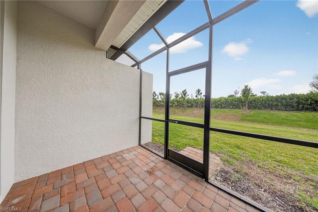 2220 Dragonfruit Way Naples, FL 34120 - Photo 21 of 31 View of unfurnished sunroom