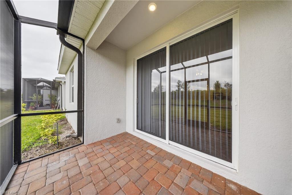 2220 Dragonfruit Way Naples, FL 34120 - Photo 22 of 31 View of unfurnished sunroom