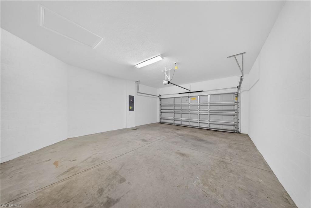2220 Dragonfruit Way Naples, FL 34120 - Photo 23 of 31 Garage with electric panel