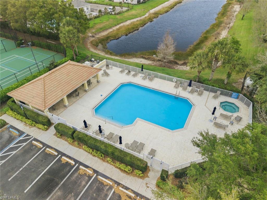2220 Dragonfruit Way Naples, FL 34120 - Photo 28 of 31 Community pool with a patio, a water view, and a community hot tub