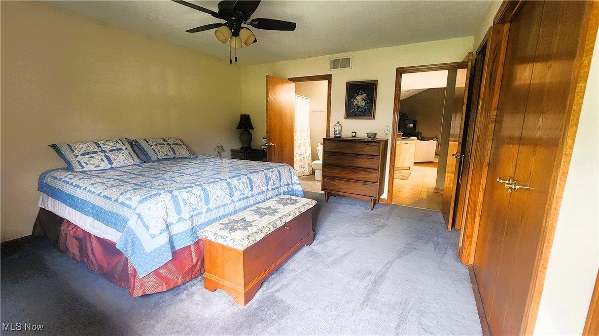 8329 Seasons Road Streetsboro, OH 44241 - Photo 23 of 35 Bedroom with ceiling fan and light tile patterned flooring