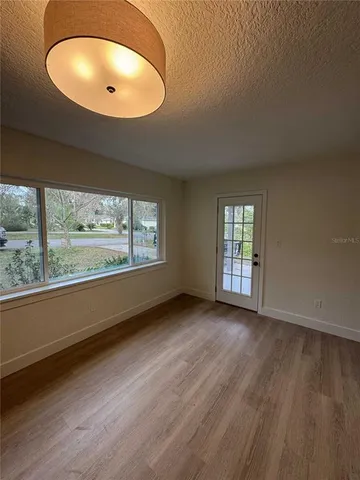 a view of kitchen with sink microwave and refrigerator