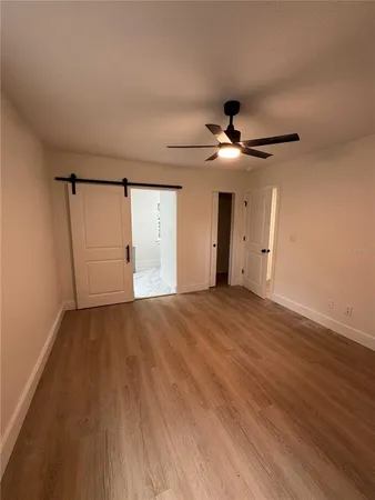 an empty room with wooden floor