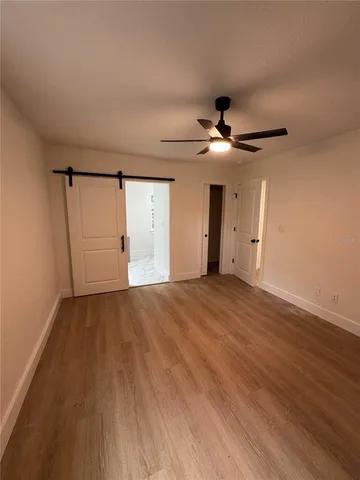 an empty room with wooden floor