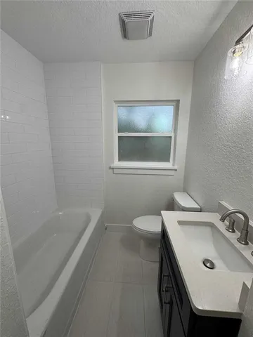 a bathroom with a sink and a bathtub