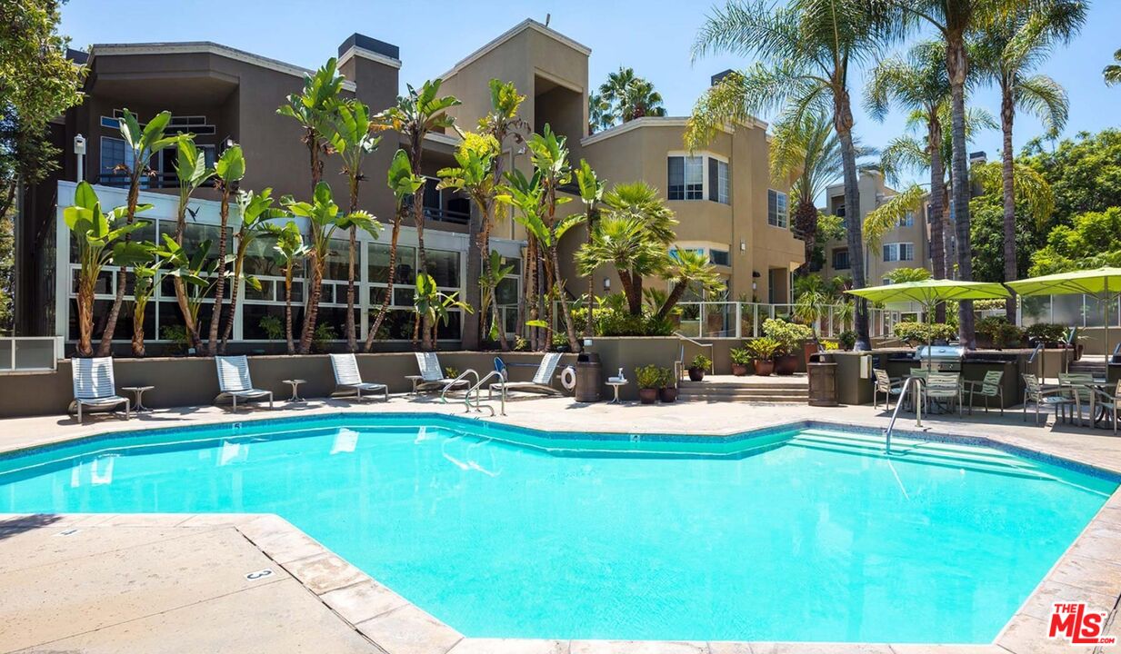 1420 Peerless Place, Unit 213 Los Angeles, CA 90035 - Photo 7 of 10 a view of a house with swimming pool and sitting area