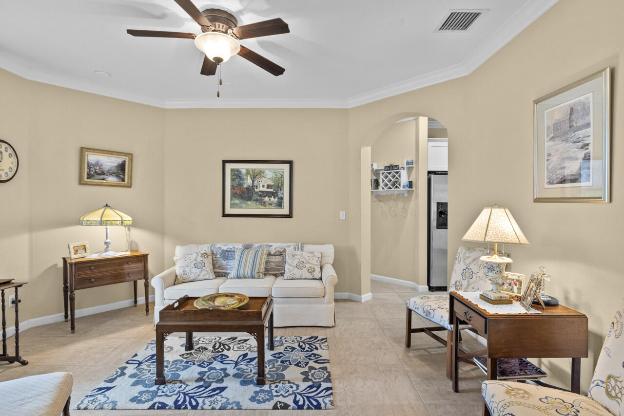 2190 Northwest Dalea Way Stuart, FL 34994 - Photo 12 of 31 a living room with furniture a rug and a window