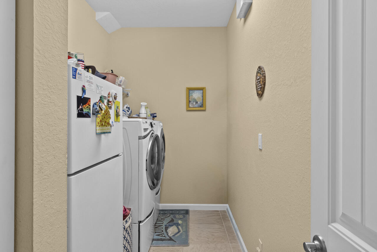 2190 Northwest Dalea Way Stuart, FL 34994 - Photo 23 of 31 a view of a storage & utility room with a refrigerator