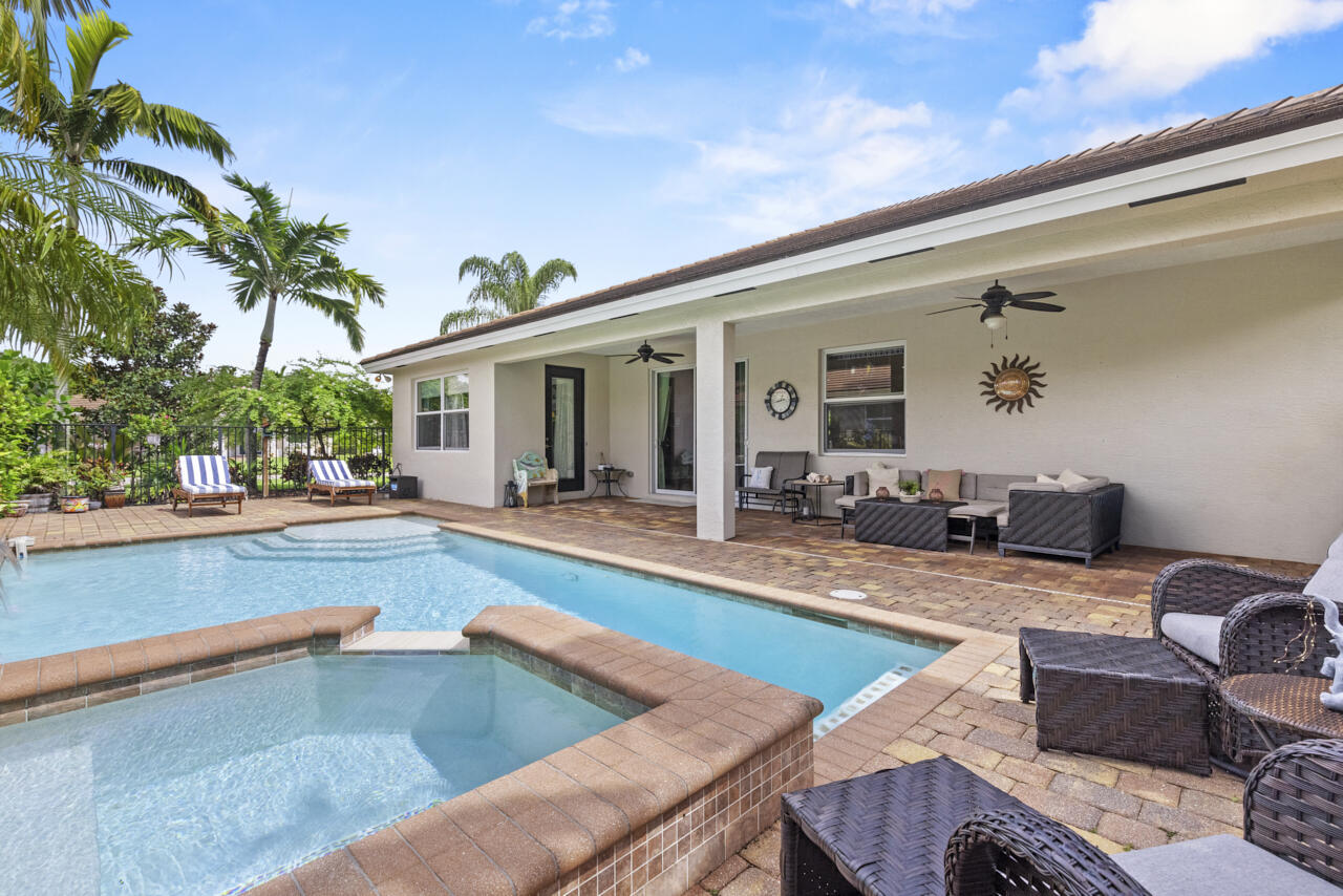 2190 Northwest Dalea Way Stuart, FL 34994 - Photo 24 of 31 a view of a house with swimming pool and sitting area
