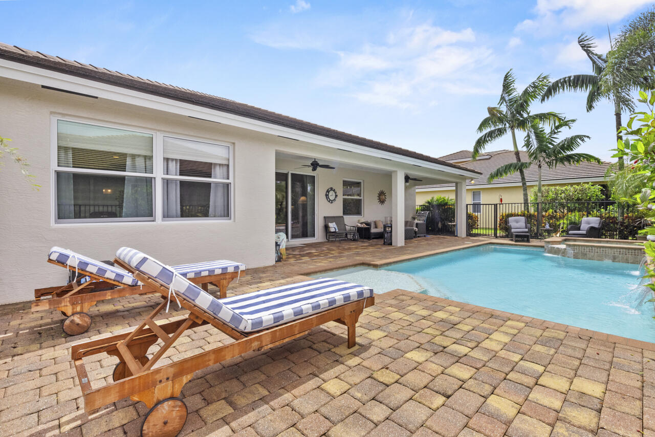 2190 Northwest Dalea Way Stuart, FL 34994 - Photo 25 of 31 a outdoor space with lots of white furniture