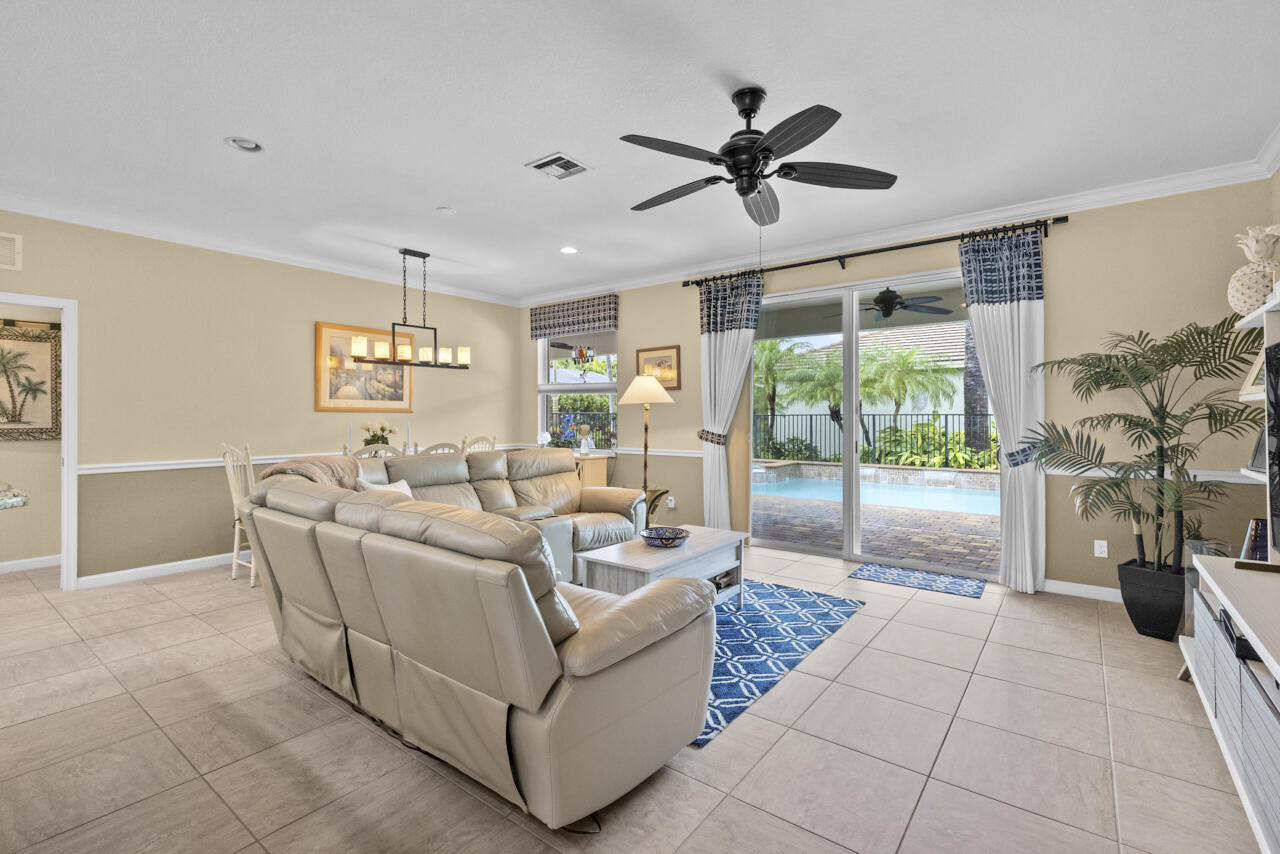 2190 Northwest Dalea Way Stuart, FL 34994 - Photo 3 of 31 a living room with furniture and a floor to ceiling window