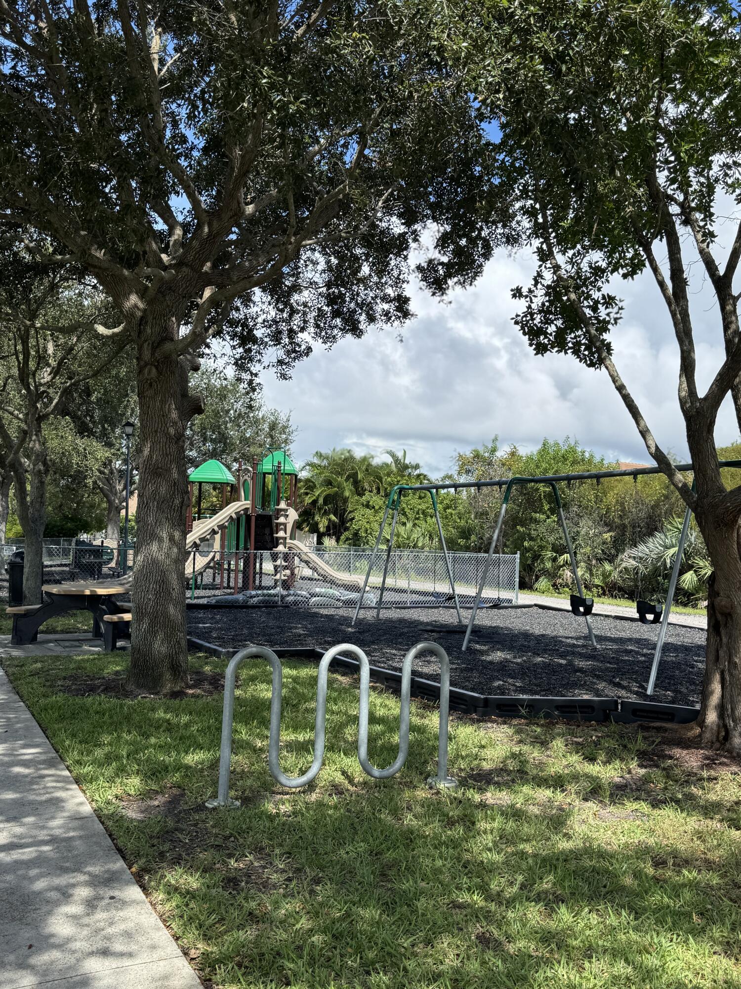 2190 Northwest Dalea Way Stuart, FL 34994 - Photo 4 of 31 a view of swimming pool with seating area and green space