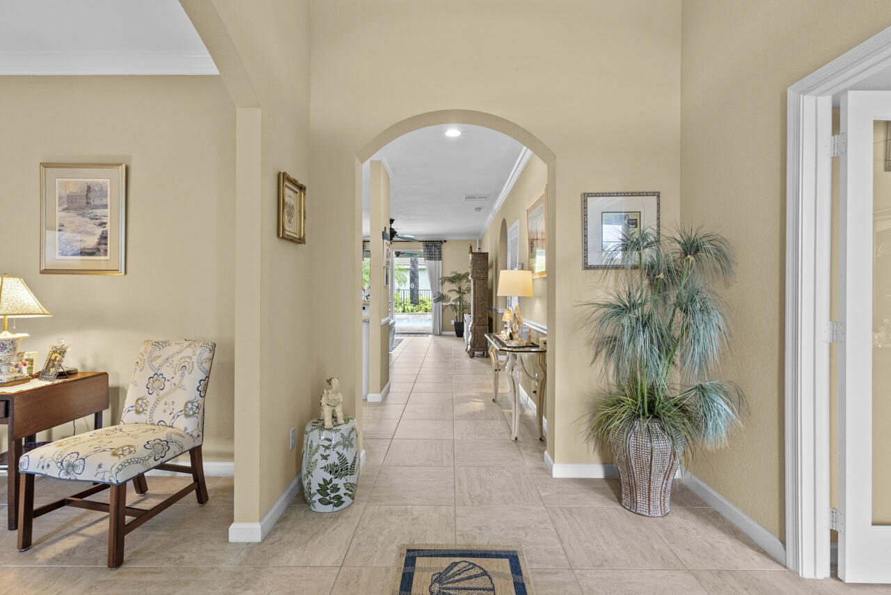 2190 Northwest Dalea Way Stuart, FL 34994 - Photo 9 of 31 a living room with furniture and a potted plant