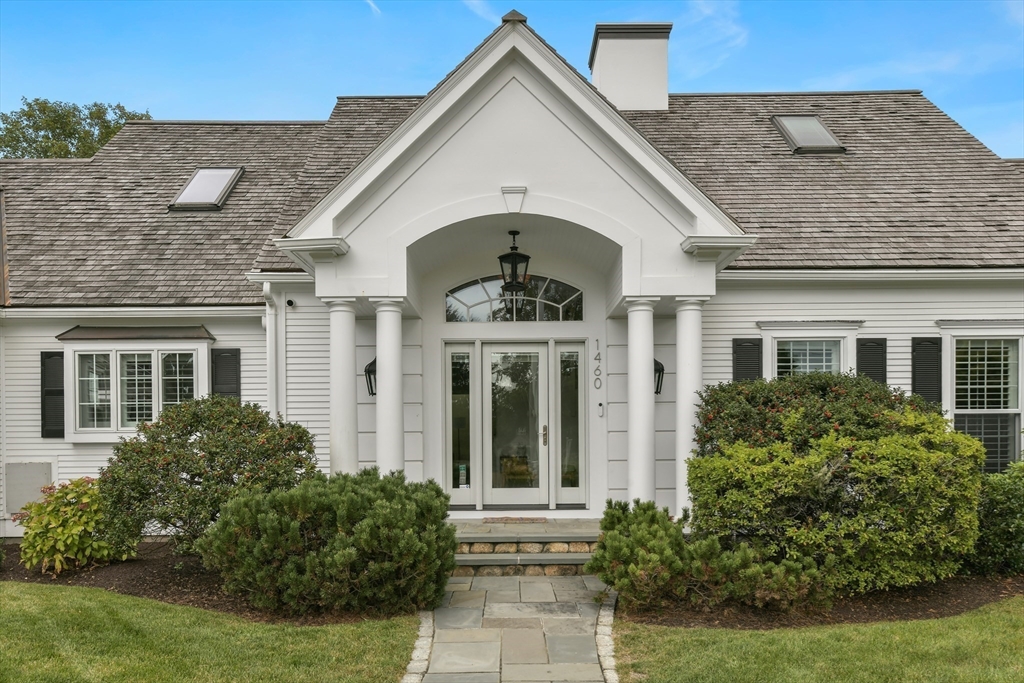1460 South County Road Barnstable, MA 02655 - Photo 29 of 40 front view of a house with potted plants