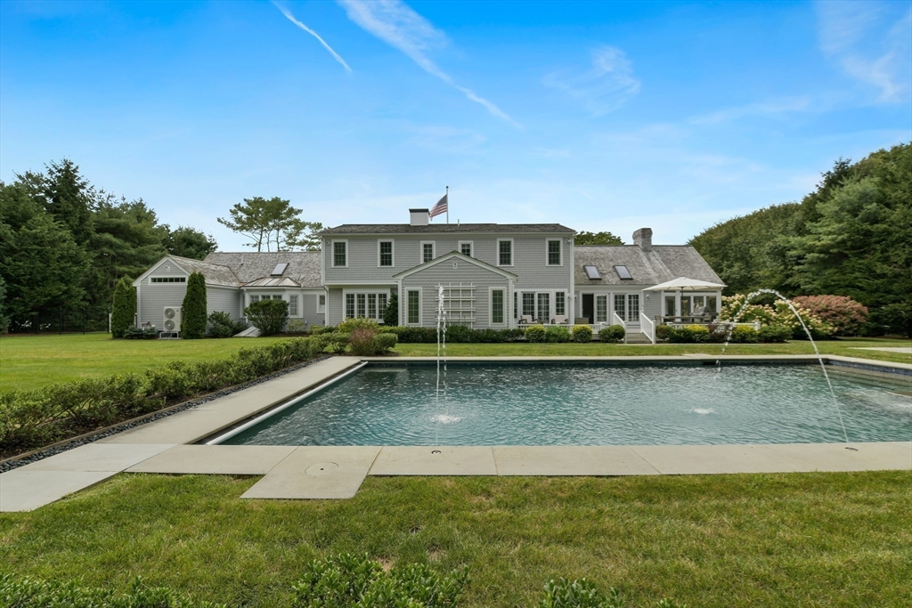 1460 South County Road Barnstable, MA 02655 - Photo 35 of 40 a view of a house with pool and a yard