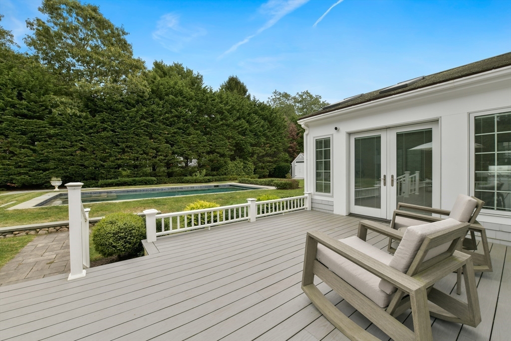 1460 South County Road Barnstable, MA 02655 - Photo 37 of 40 a view of a roof deck with couches and wooden floor