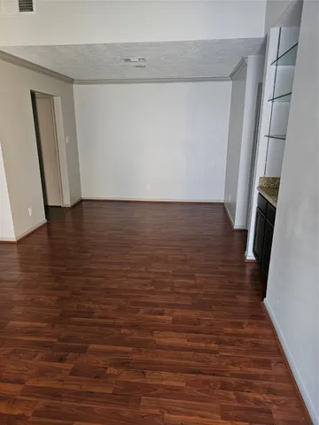 a view of room with wooden floor