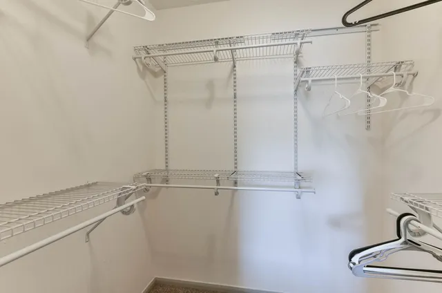 a bathroom with a shower and a sink