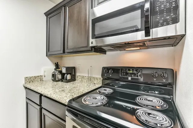 a kitchen with a stove and a microwave