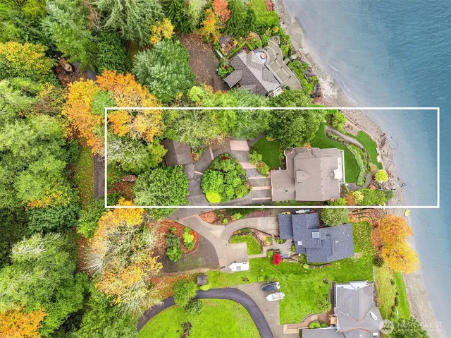a view of balcony with chairs and floor to ceiling window