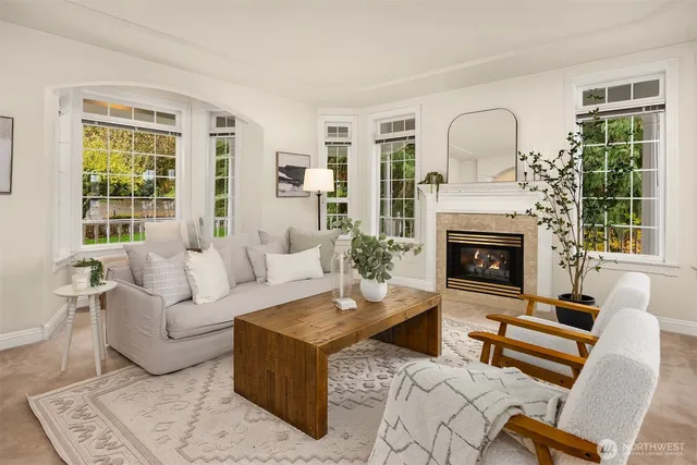 a living room with furniture and a fireplace