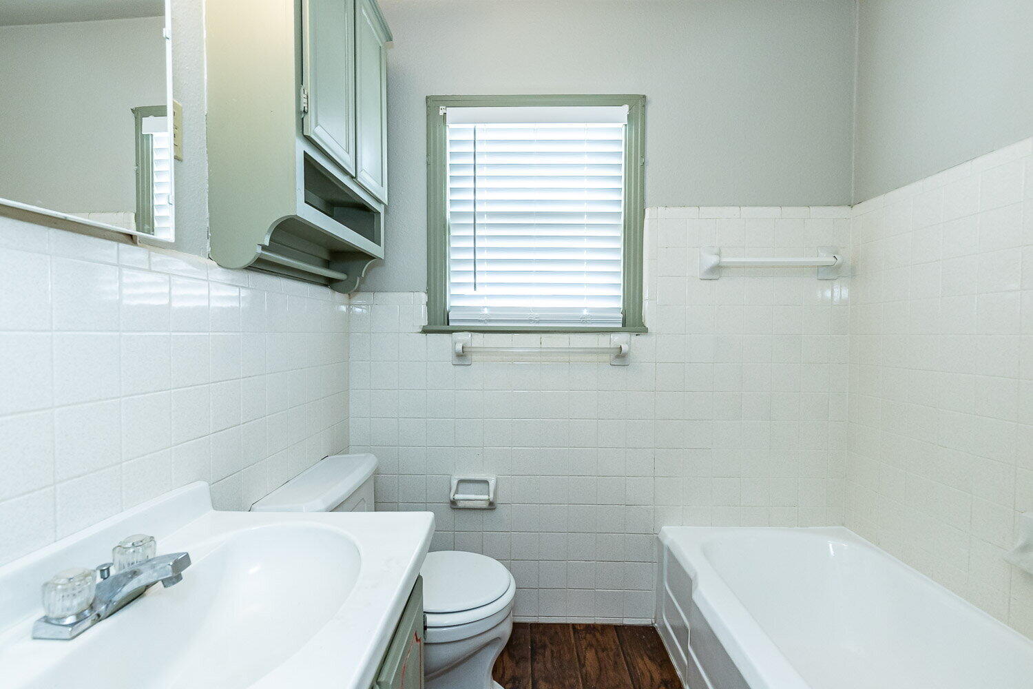 2603 39th Street Lubbock, TX 79413 - Photo 13 of 19 a bathroom with a sink a toilet and bathtub