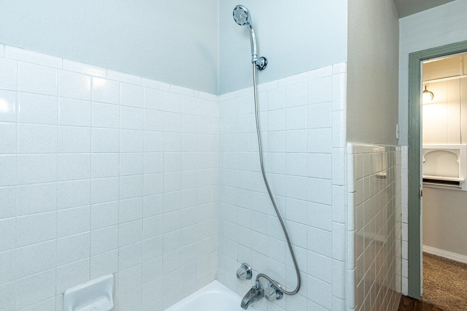 2603 39th Street Lubbock, TX 79413 - Photo 15 of 19 a bathroom with a glass shower door