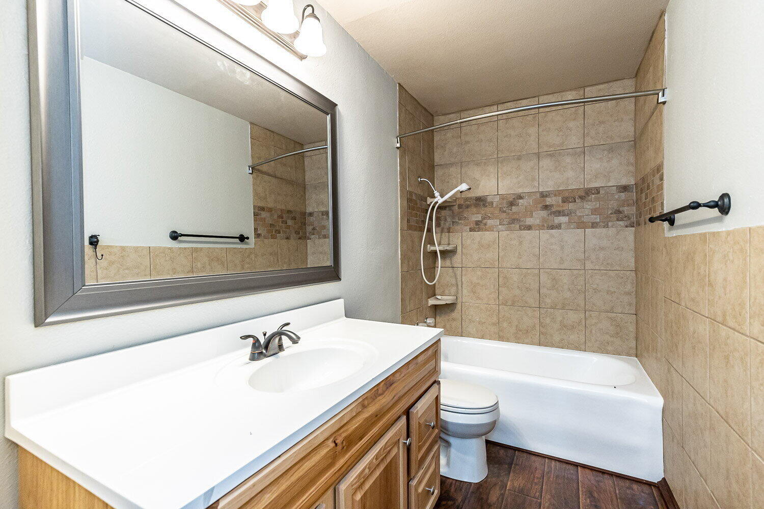 2603 39th Street Lubbock, TX 79413 - Photo 16 of 19 a bathroom with a sink a toilet and shower