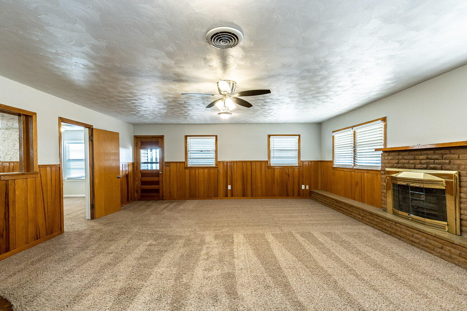 2603 39th Street Lubbock, TX 79413 - Photo 7 of 19 a view of an empty room with window and cabinet