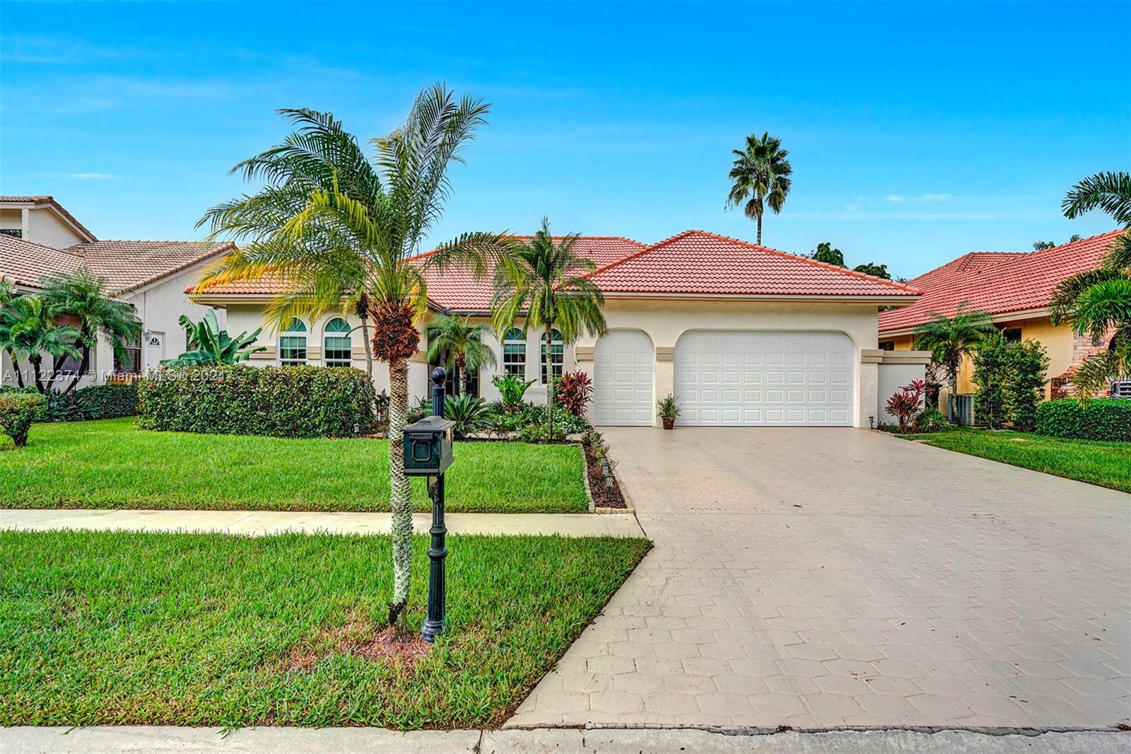 19609 Sedgefield Terrace Boca Raton, FL 33498 - Photo 1 of 43 a front view of house with yard and green space