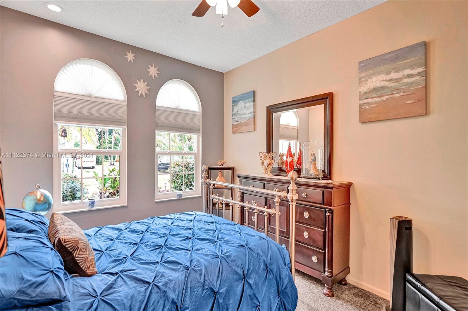 19609 Sedgefield Terrace Boca Raton, FL 33498 - Photo 33 of 43 a bedroom with furniture and a window
