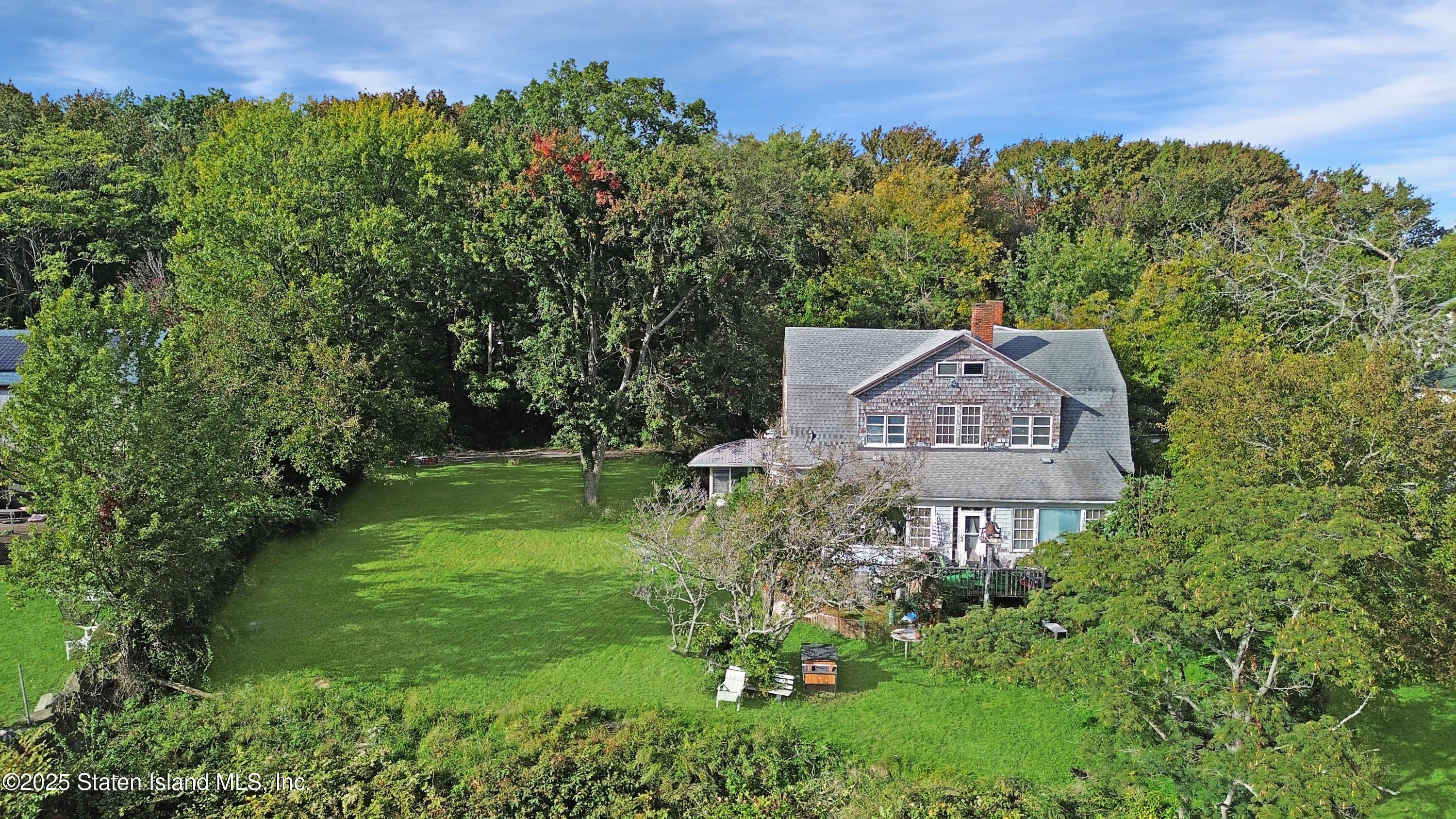 40 Yeomalt Avenue Staten Island, NY 10312 - Photo 5 of 7 a view of a garden with a building in the background