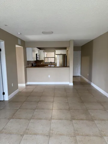 a view of a livingroom with furniture and window