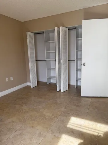 an empty room with closet