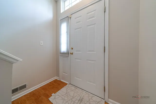 a bathroom with a sink mirror and vanity