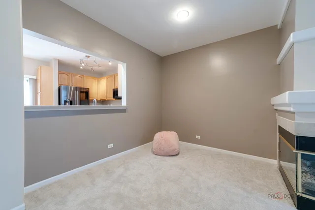 an empty room with furniture and a fireplace