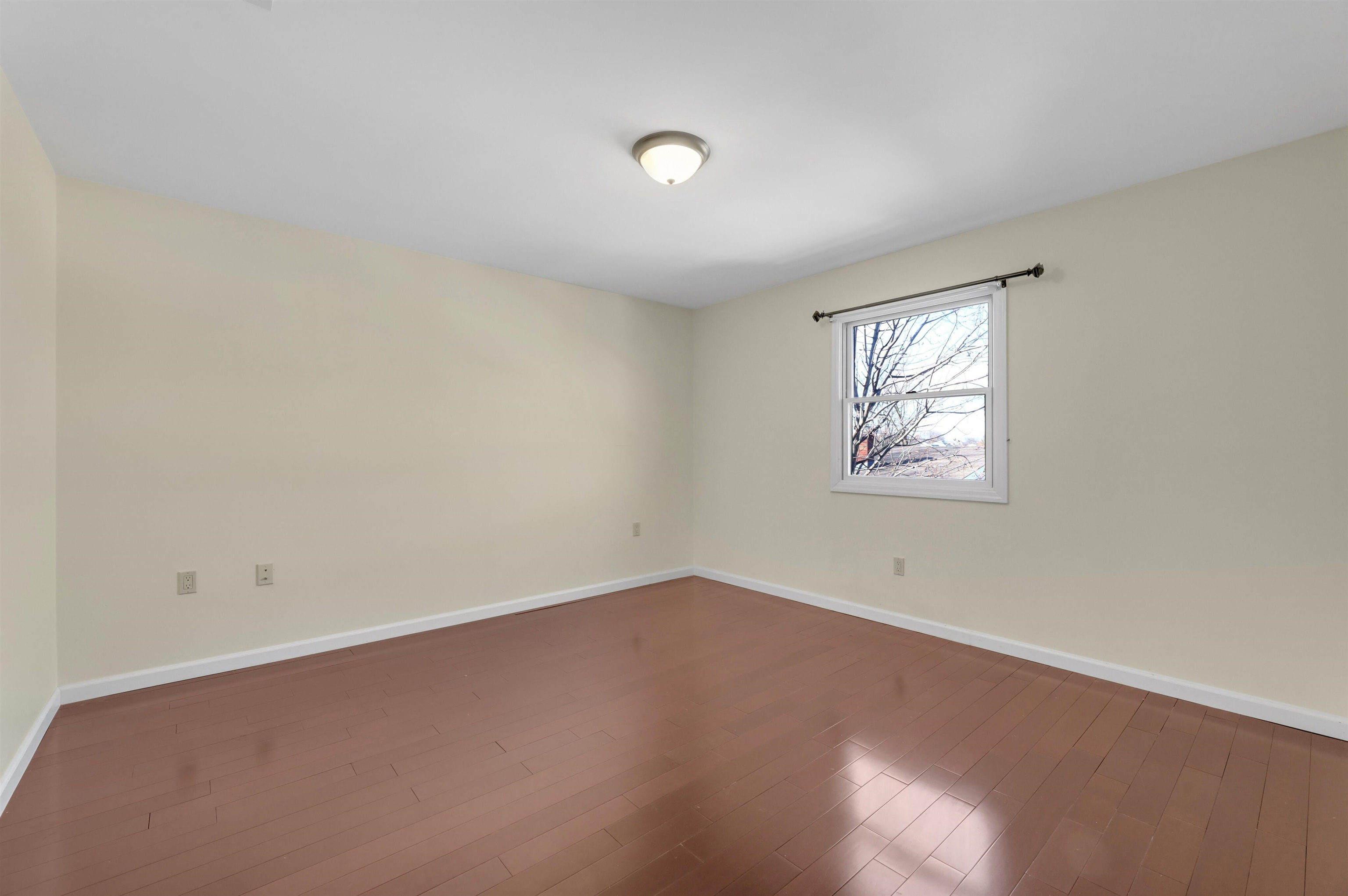 733 Chestnut Street, Unit A Secaucus, NJ 07094 - Photo 13 of 20 an empty room with a window