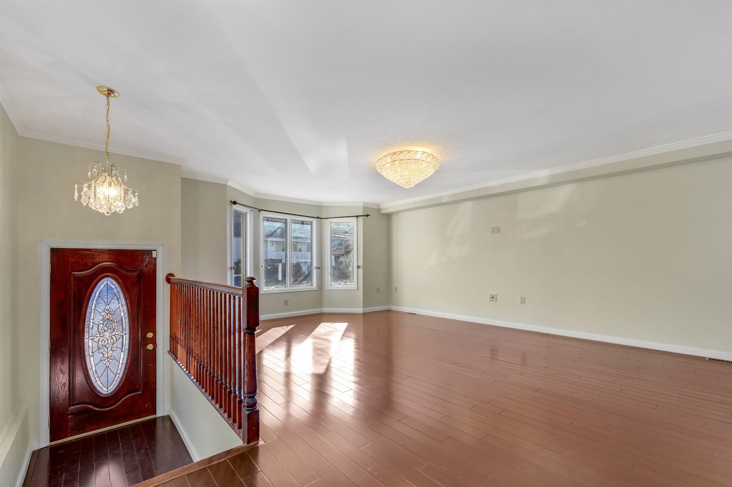 733 Chestnut Street, Unit A Secaucus, NJ 07094 - Photo 2 of 20 a view of an empty room with window and wooden floor