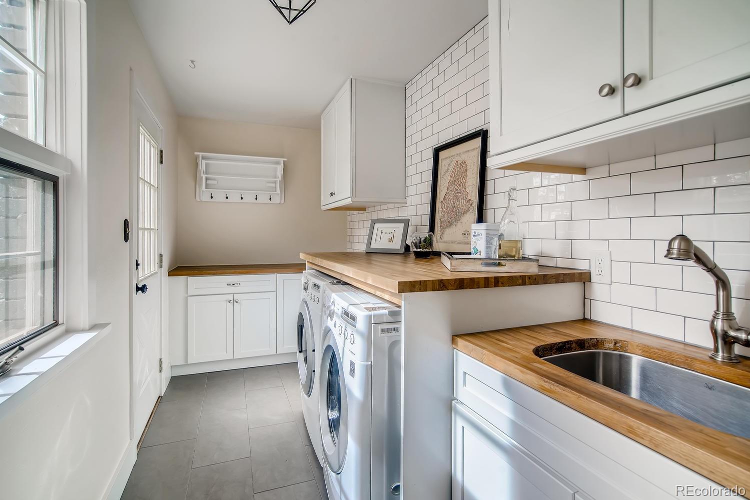 1894 La Quinta Circle Evergreen, CO 80439 - Photo 17 of 36 a kitchen with a sink stove and cabinets