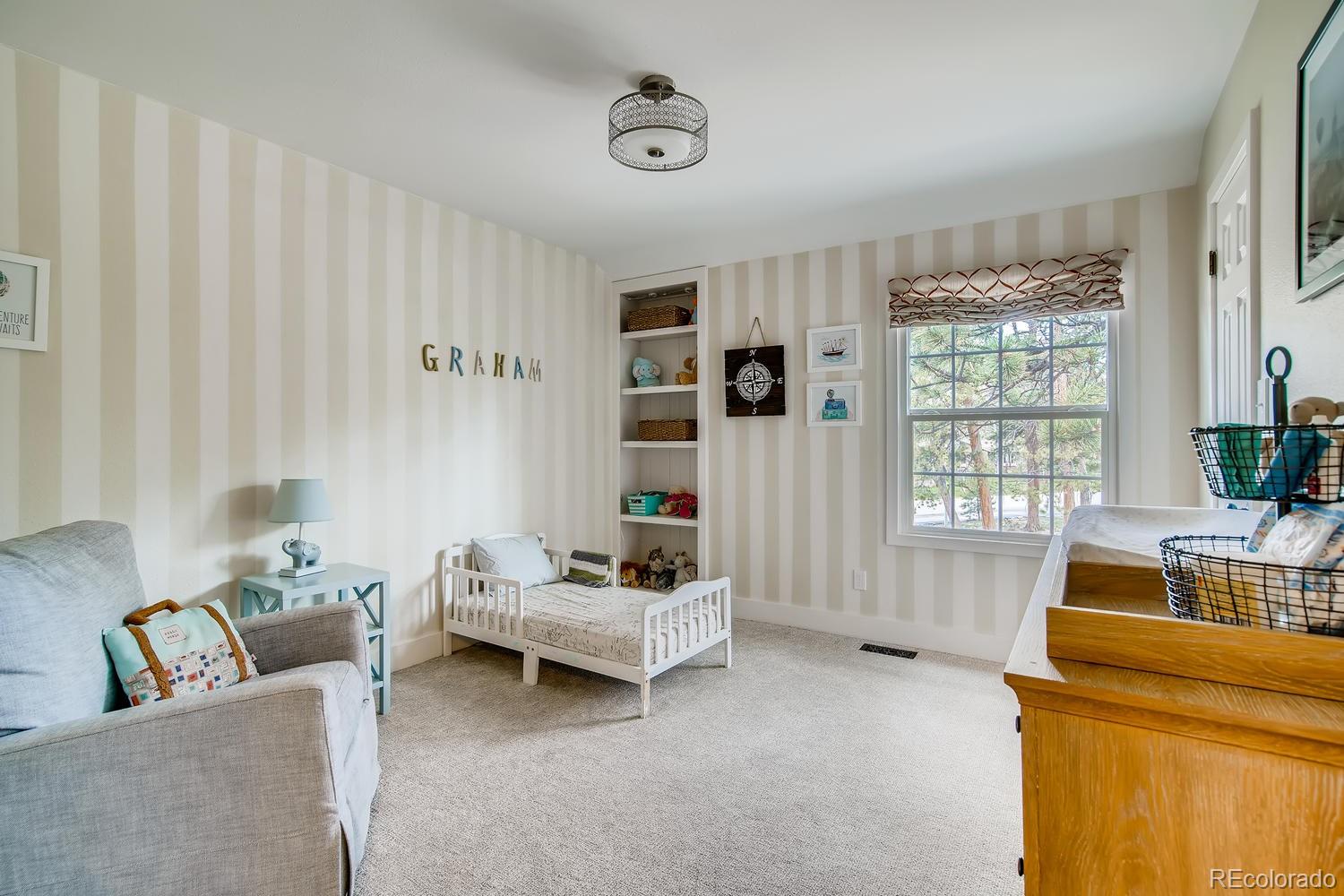 1894 La Quinta Circle Evergreen, CO 80439 - Photo 23 of 36 a living room with furniture and a window