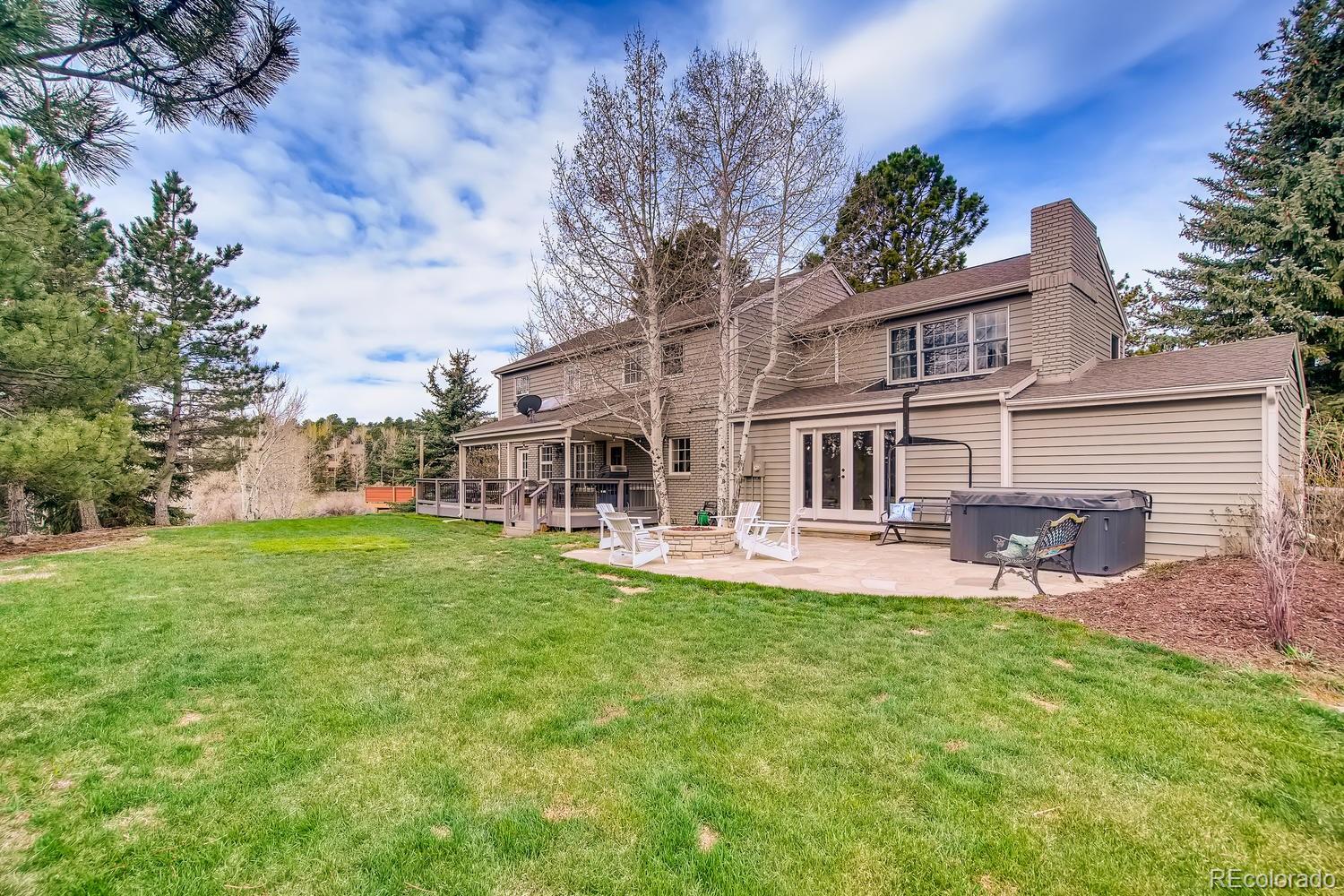 1894 La Quinta Circle Evergreen, CO 80439 - Photo 32 of 36 a front view of house with yard and seating area