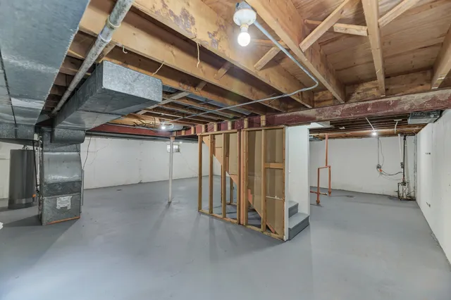 a view of empty room with wooden ceiling