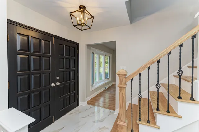a view of staircase with wooden floor and stairs