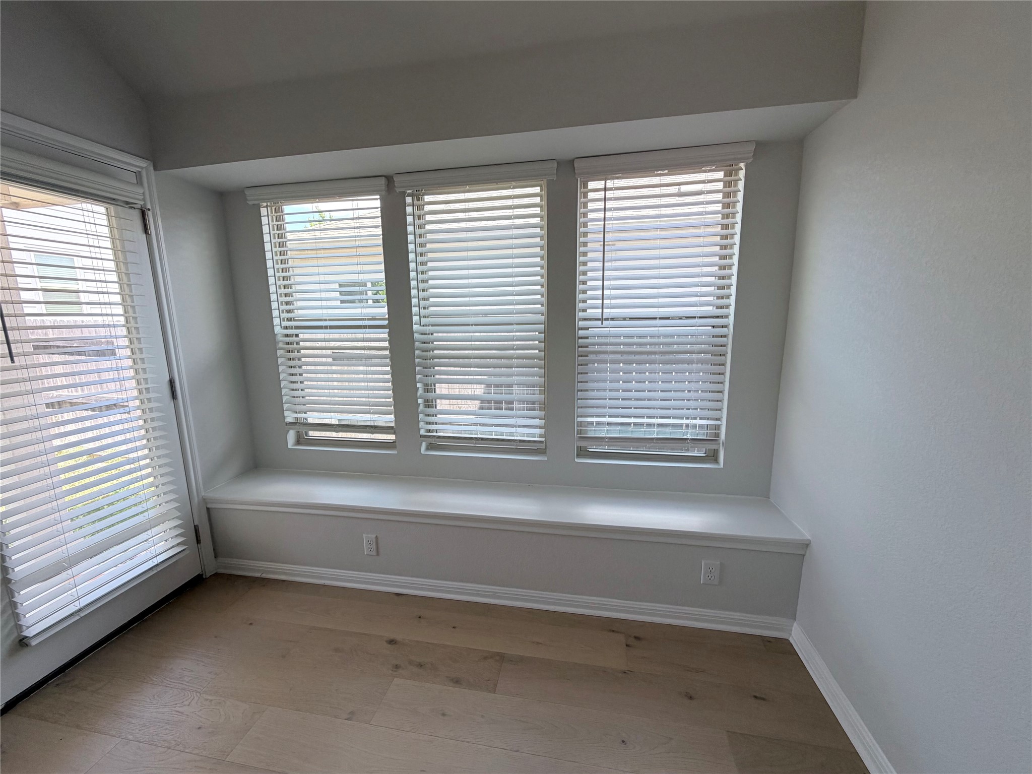 2813 Hopi Path, Unit 11 Leander, TX 78641 - Photo 14 of 17 Spare room with light wood-style floors and vaulted ceiling