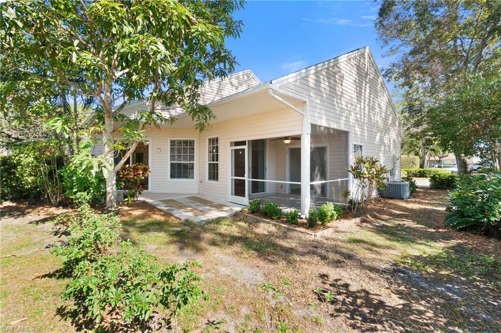 2662 Aft Avenue Naples, FL 34109 - Photo 17 of 26 Rear view of house featuring a sunroom, a patio, and a ceiling fan