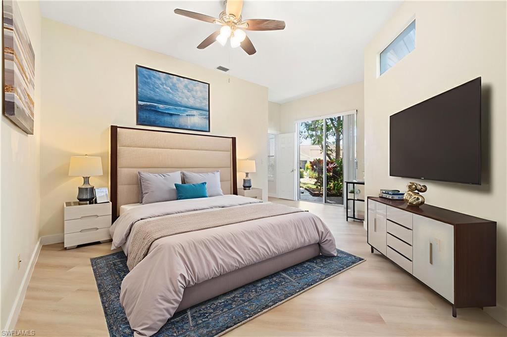 2662 Aft Avenue Naples, FL 34109 - Photo 3 of 26 Bedroom featuring access to outside, light wood finished floors, and a ceiling fan
