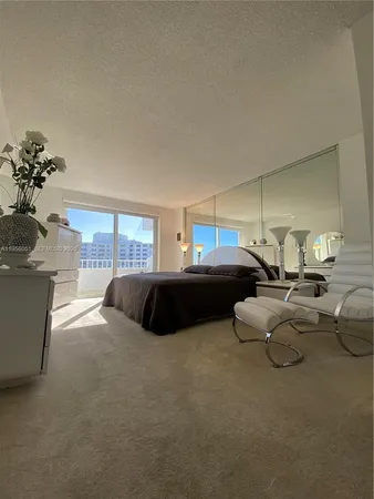 a bedroom with bed and window