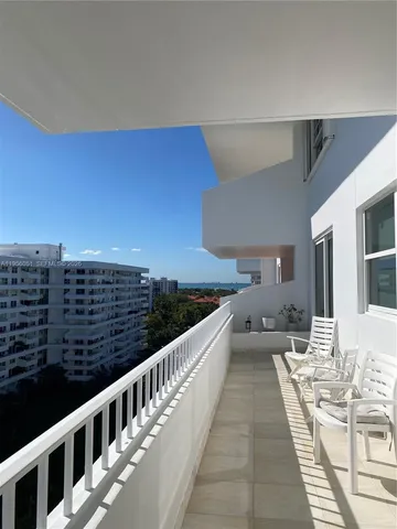 a view of balcony with furniture