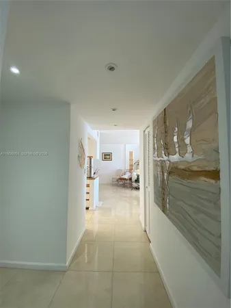 a bathroom with a glass door shower